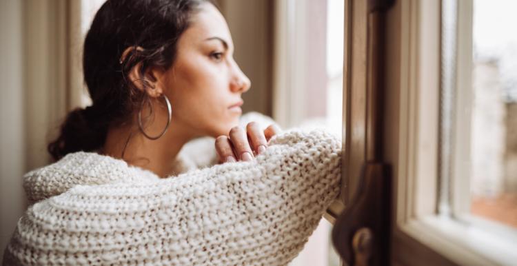 Lady looking out of window